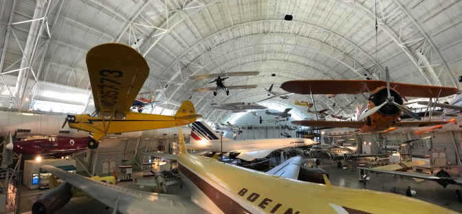 Panorama of hangar in the Udvar-Hazy Center with numerous airplanes.