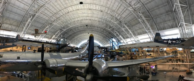 Panorama of Udvar-Hazy Center with numerous airplanes throughout the hangar.