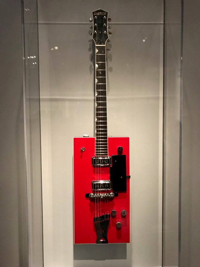 Rectangular guitar body, shaped red, with Gretsch neck.