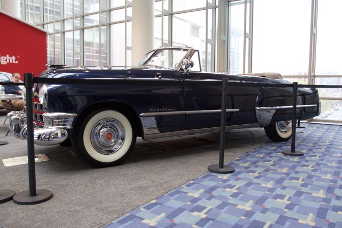 Blue Cadillac convertible.