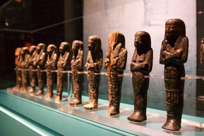 Small statues in a row.