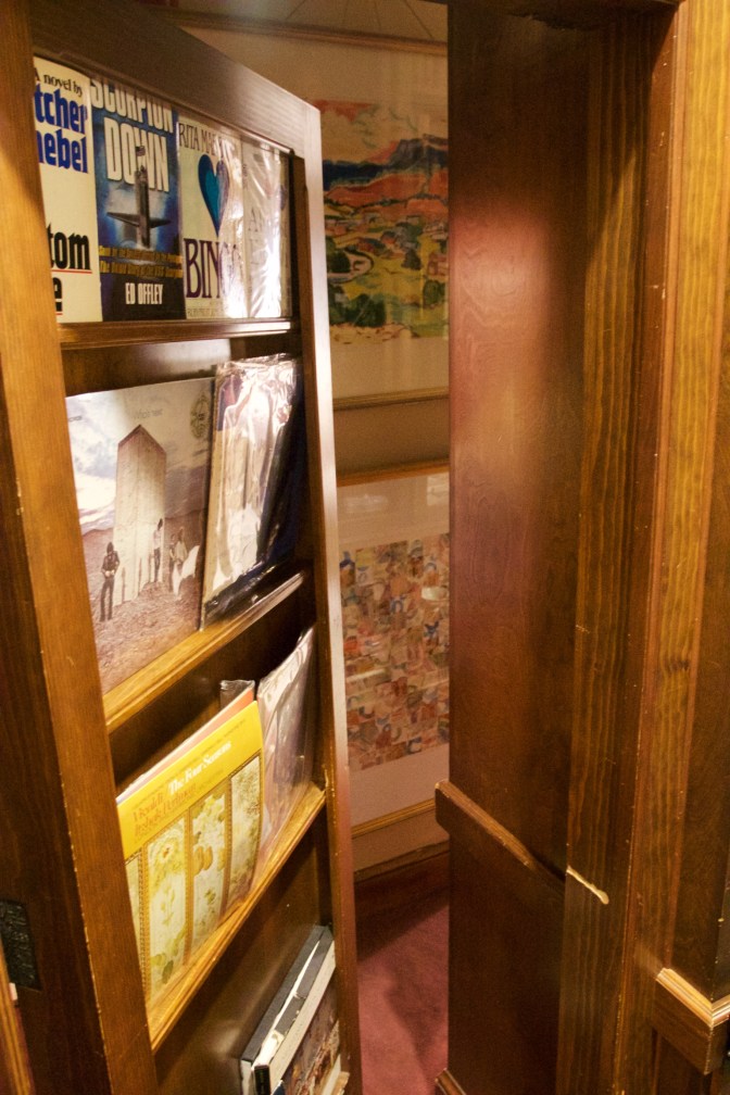 Secret door in a bookcase, leading to another room.