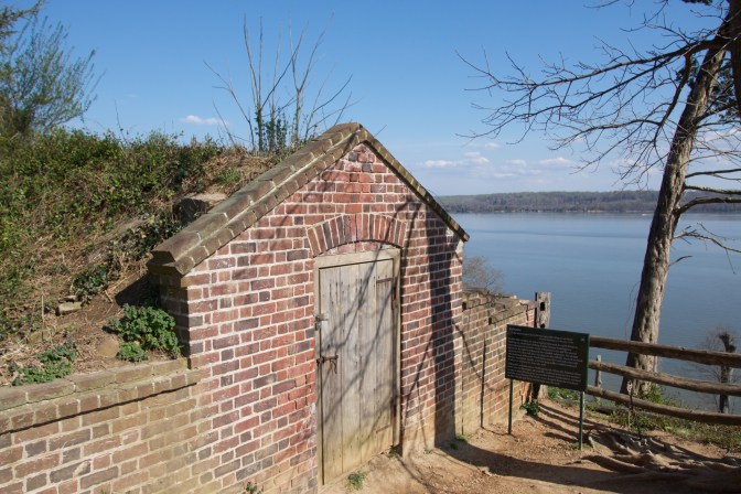 Small brick ice house near the edge of the property.