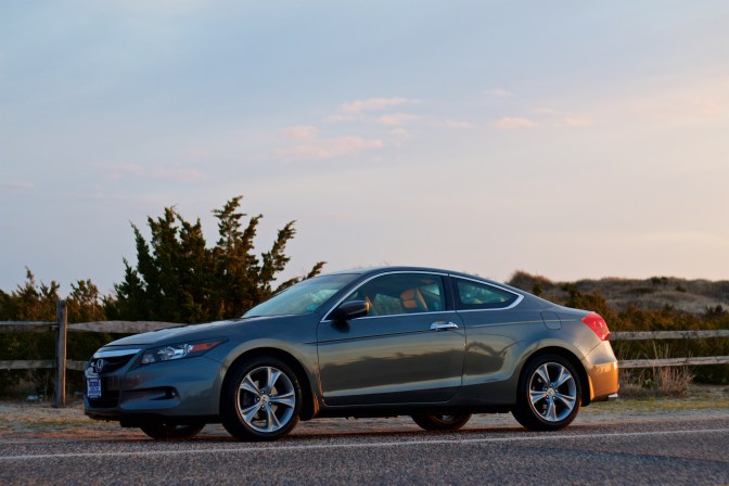 2012 Honda Accord coupe, gray, in front of sand dunes.