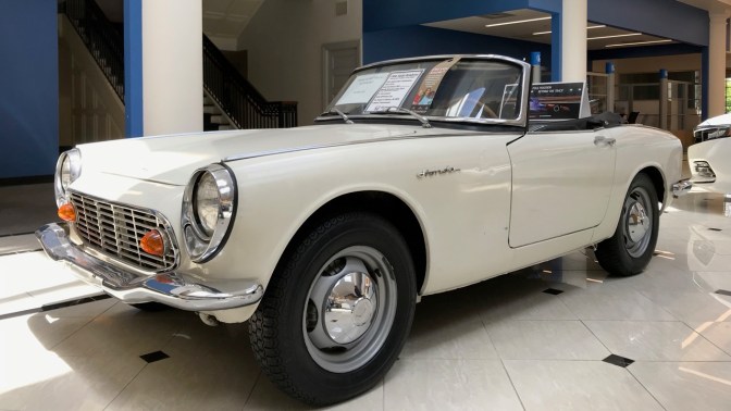White 1966 Honda S600 roadster.