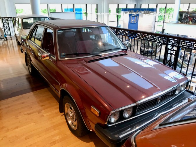 Maroon Honda Accord sedan, first generation.