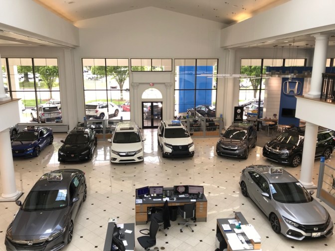 Showroom of Keenan Honda, with various Honda models spread out across the showroom floor.