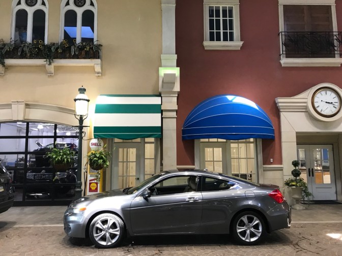 2012 Honda Accord in front of European-style building facade in service drive.