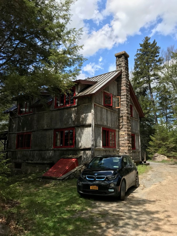 Exterior of Wigman building, with a small BMW electric car in the foreground.