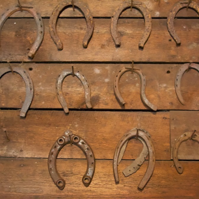 Horseshoes hanging on wall.