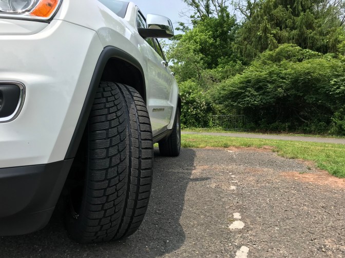 Jeep Grand Cherokee in white with Nokian WR G4 SUV tires.
