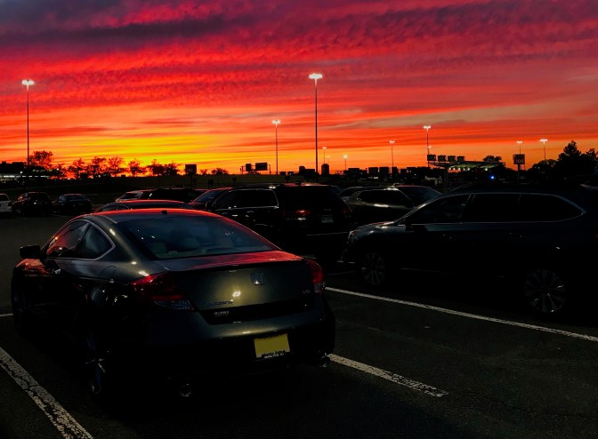 2012 Honda Accord in parking lot beneath sunset sky.