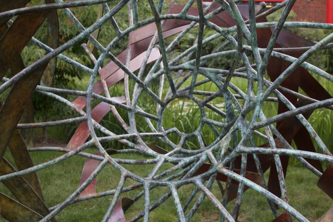 Spiral sculpture of wood and bronze.