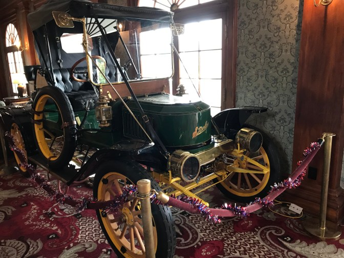 Stanley Steamer car in lobby of hotel.