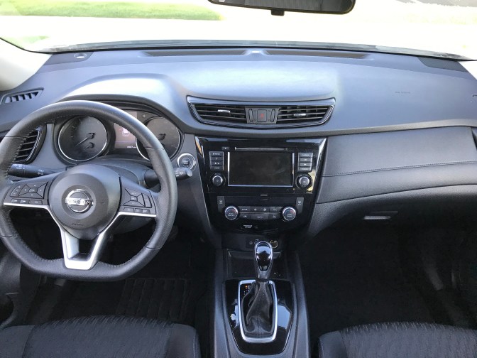 Dashboard and front seats of Nissan Rogue.