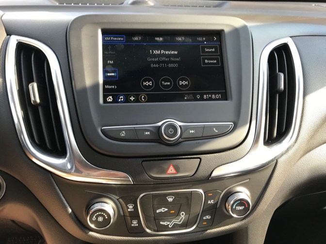 Center console of Equinox with controls for HVAC and stereo.