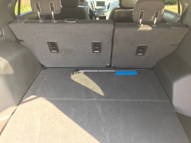 Trunk of Equinox, with snow scraper/brush in trunk.