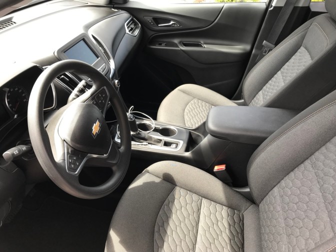 Front seats and dashboard of Chevrolet Equinox.