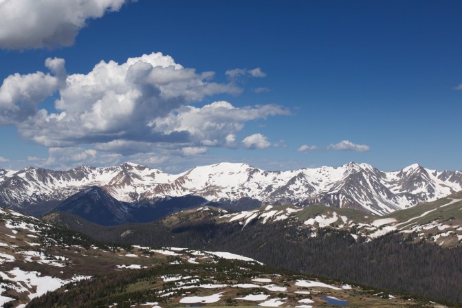 View of mountains with blue sky and clouds.