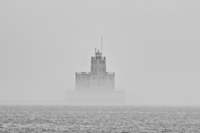 Breakwater Lighthouse, visible through fog.
