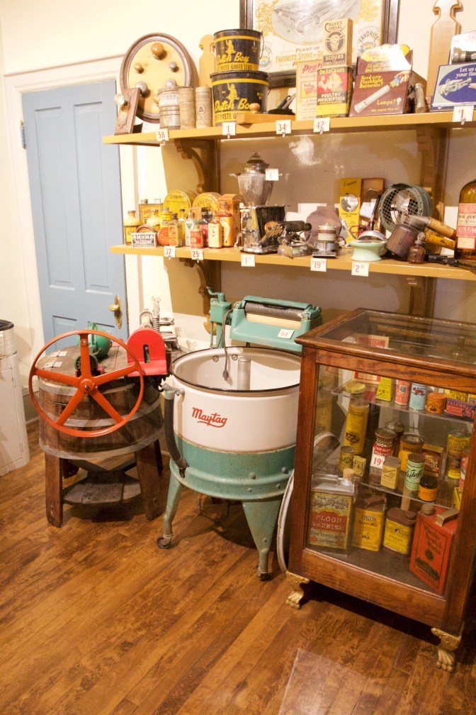 Hardware store, with old time washer and dryer along with old appliances from early 20th century.