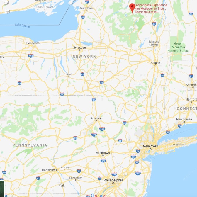 Map of New York State with red pin in location of Adirondack Experience.