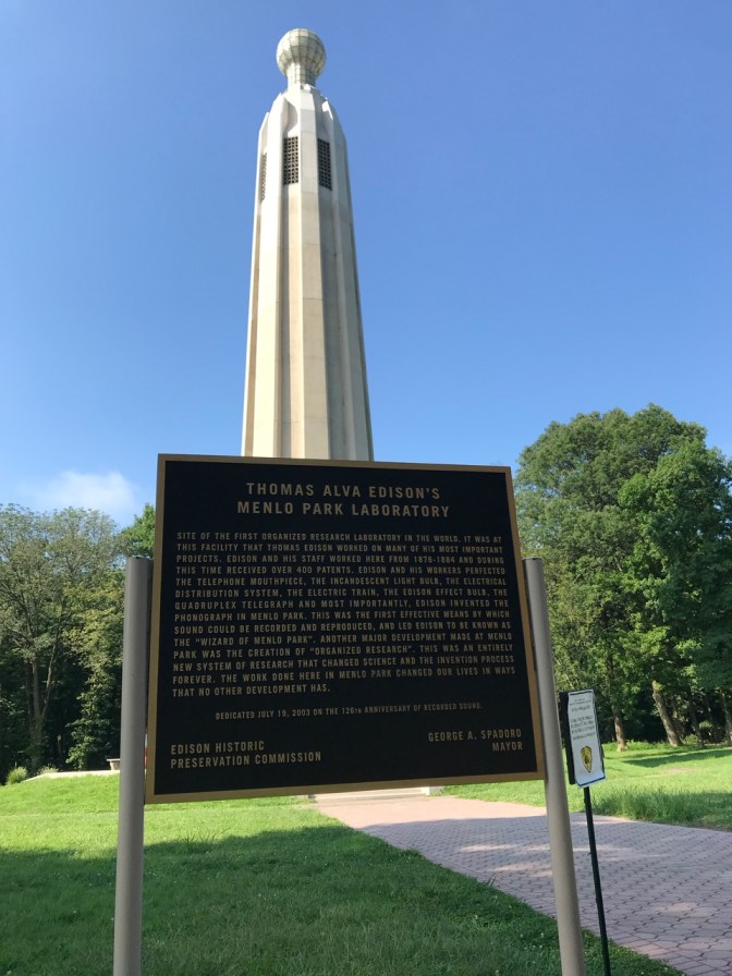 Sign in front of tower that reads THOMAS ALVA EDISON'S MENLO PARK LABORATORY.