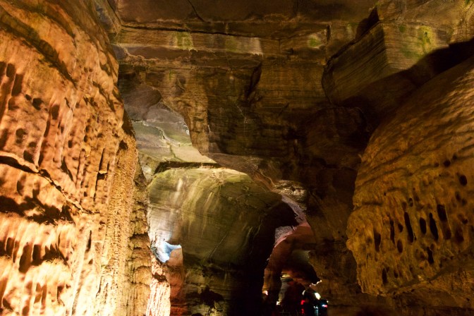 Two rock walls opposing each other with small holes in each one.