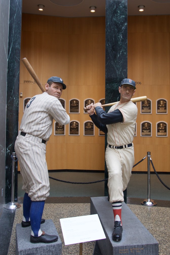 Wooden statues of Babe Ruth and Ted Williams in Hall.