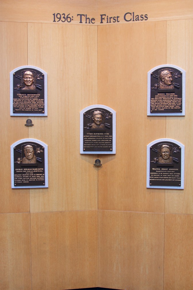Plaques of five players on wall, with the words 1936: The First Class above it.