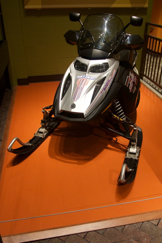 Silver and black snow mobile.