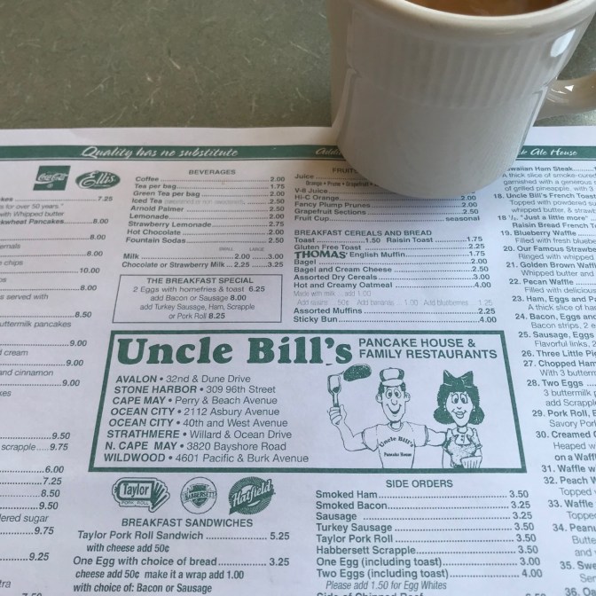 Uncle Bill's Pancake House placemat menu with a white coffee cup.