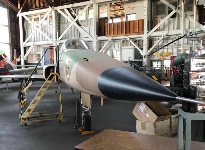 F-5 Tiger in airplane hangar.
