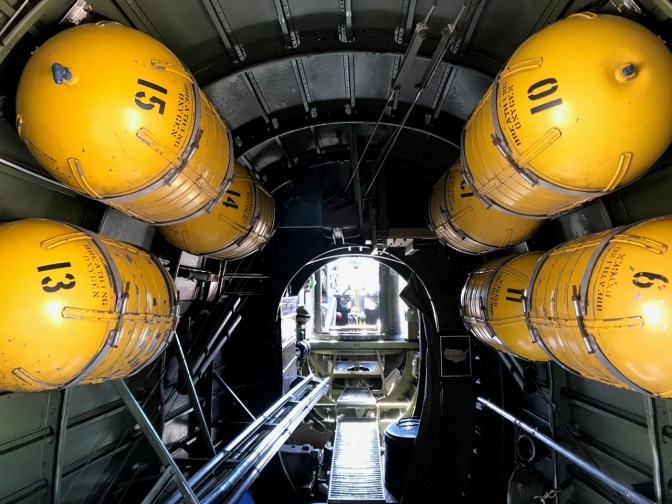 Oxygen tanks suspended from interior fuselage of B-24.