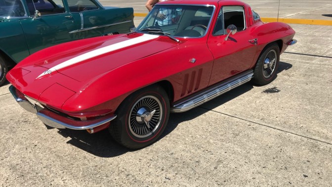 Red Chevrolet Corvette hardtop.