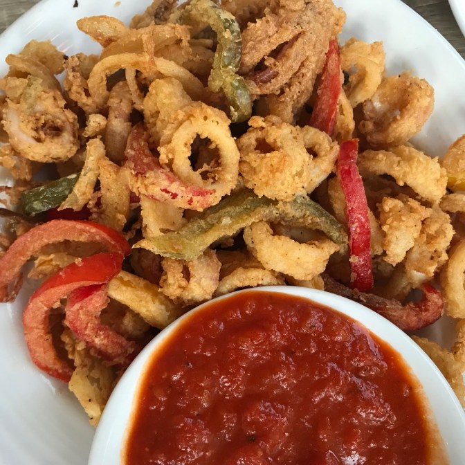 Fried calamari with marinara sauce side.