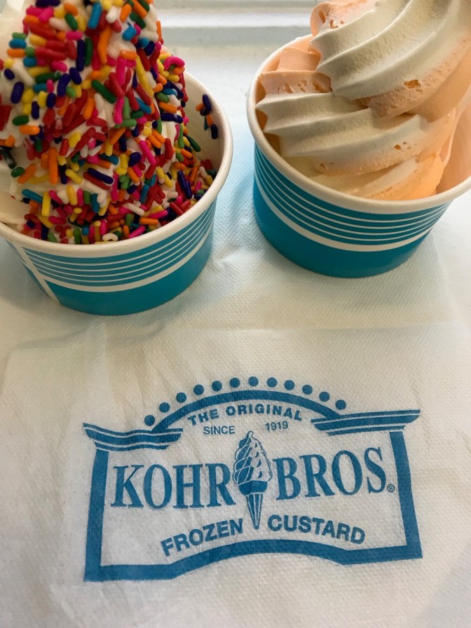 Two cups of custard, one with vanilla and sprinkles (left) and an orange and vanilla twist (right).