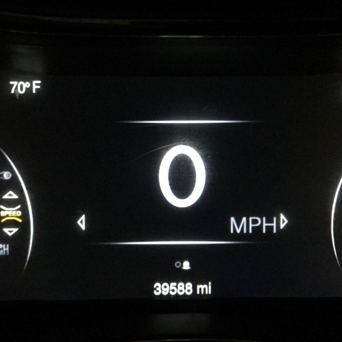 Car odometer that reads 39,588 miles.