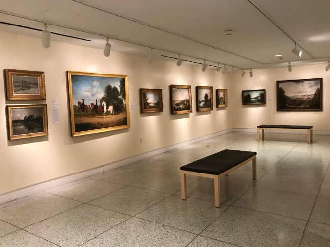 Small art gallery with paintings.