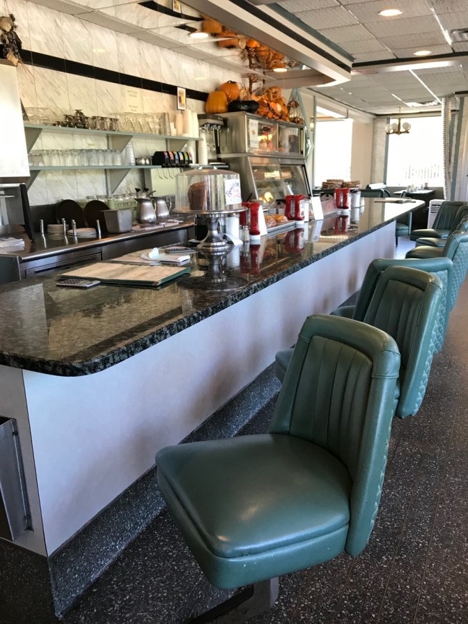 Diner counter, with seven open seats.