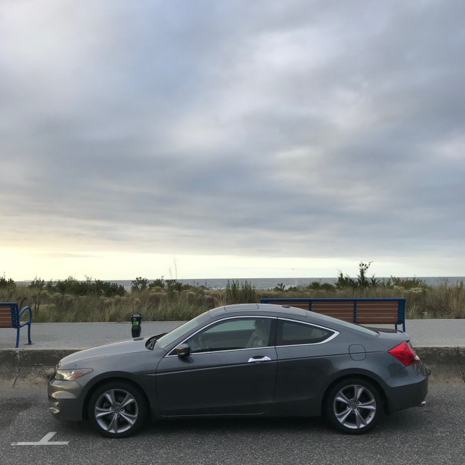 2012 Honda Accord parked in front of beach.