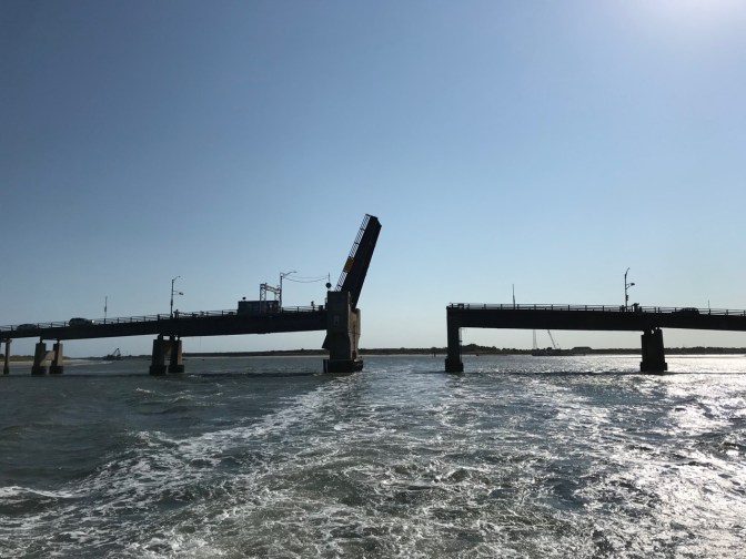 Drawbridge up over harbor.