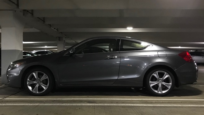 Exterior of 2012 Honda Accord coupe in a parking garage.