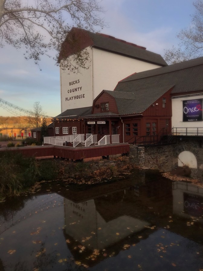 Exterior of Bucks County Playhouse, with a small pond in the foreground.