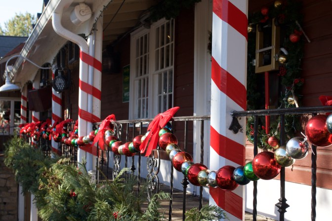 Christmas decorations on walls of Cock and Bull restaurant.