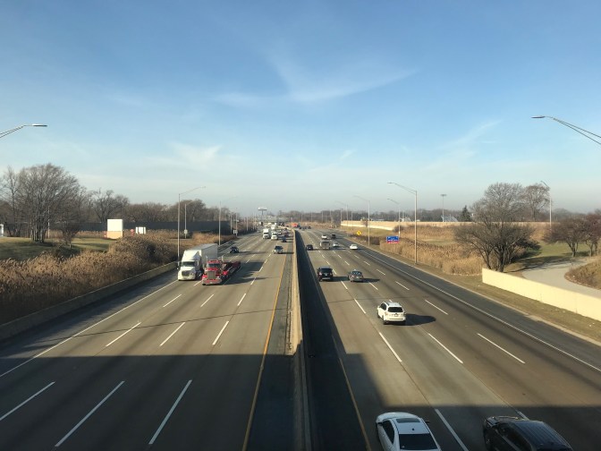 View overlooking I-90 traffic from rest stop in Illinois.
