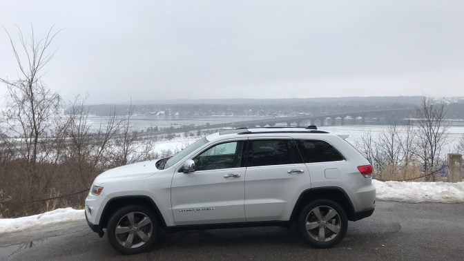 2014 Jeep Grand Cherokee on bluff overlooking St. Croix River.