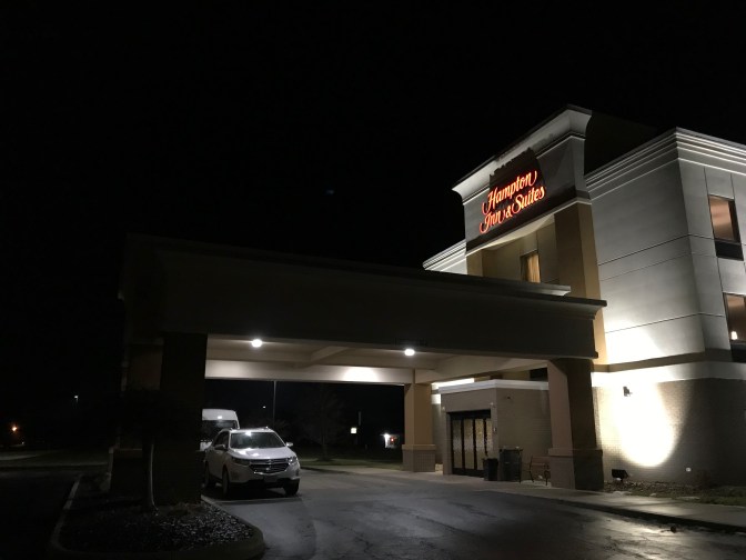 Exterior of Hampton Inn & Suites hotel at night.