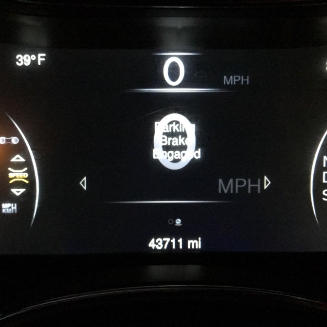 Car odometer reading 43,711 miles.