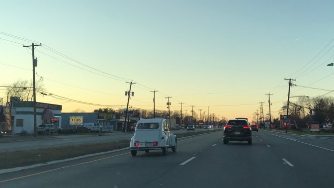 Citroen 2CV in left-hand lane.